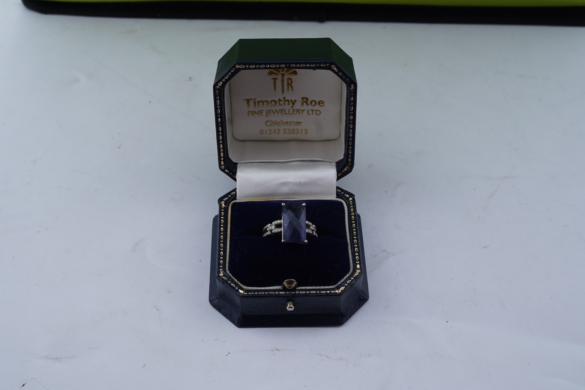 An iolite and diamond ring